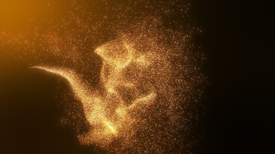 El oro naranja brilla con partículas de polvo que fluyen. photo