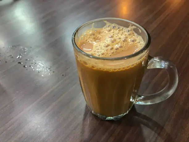 Photo of Selective focus with noise effect of tea with milk or popularly known as Teh Tarik