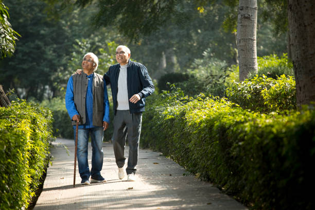 istock Two senior men having fun at park 1372548547