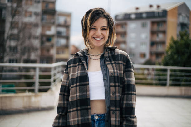 Photo of beautiful teenage girl with dreadlocks smiling Photo of beautiful teenage girl with dreadlocks smiling.She is looking at camera. Front view. crop top view stock pictures, royalty-free photos & images