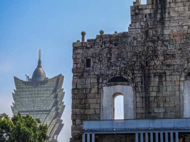 Macau, Island of Macau, China - September 13 2019: view of the  Cassino Lisboa and the Saint Paul's Cathedral ruins, a contrast of modern and ancient construction