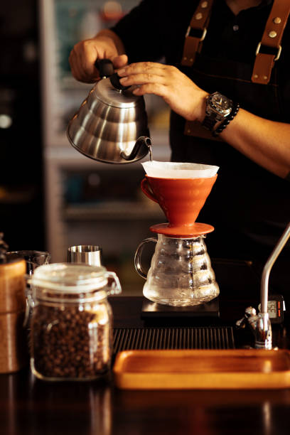 istock Young Male Barista Use V60 to make coffee 1372559210