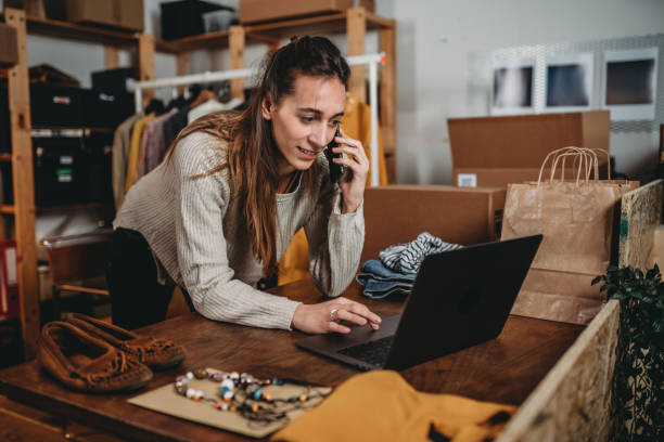 istock A woman is checking her laptop while she's talking at the phone 1372559850