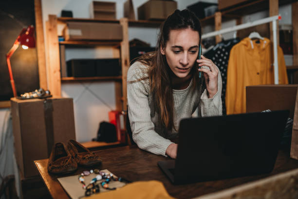 istock A woman is checking her laptop while she's talking at the phone 1372559855