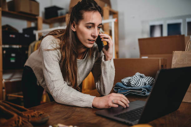 istock A woman is checking her laptop while she's talking at the phone 1372559867