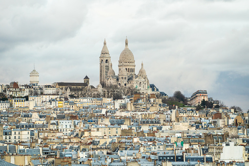 Montmartre and Sacre-Coeur basilica as seen from the city center of Paris, France