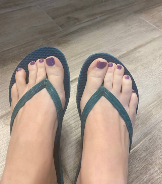 istock Flip flips and purple toes 1372561304