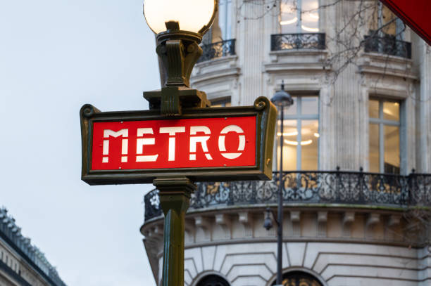 Metro sign in Paris A metro sign in Paris, France paris metro sign stock pictures, royalty-free photos & images
