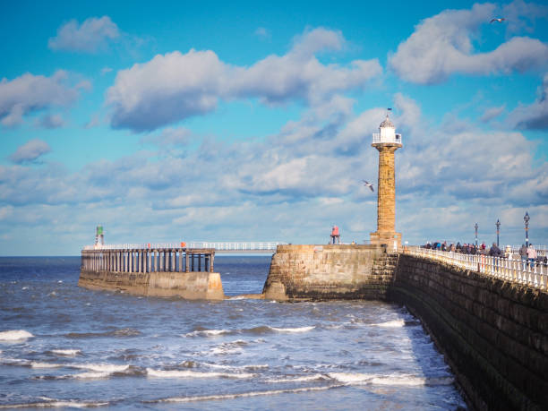 istock Whitby piers seaside clouds winter lighthouse 1372564519