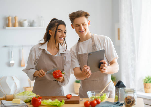 istock couple is preparing the proper meal 1372564665
