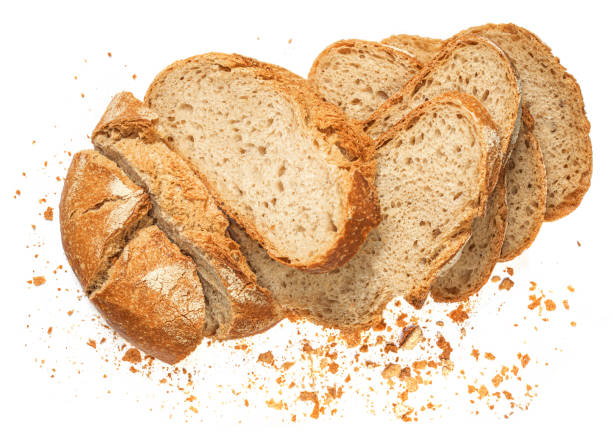 istock Sliced multigrain bread isolated on a white background closeup. Fresh bread loaf with  crumbs. 