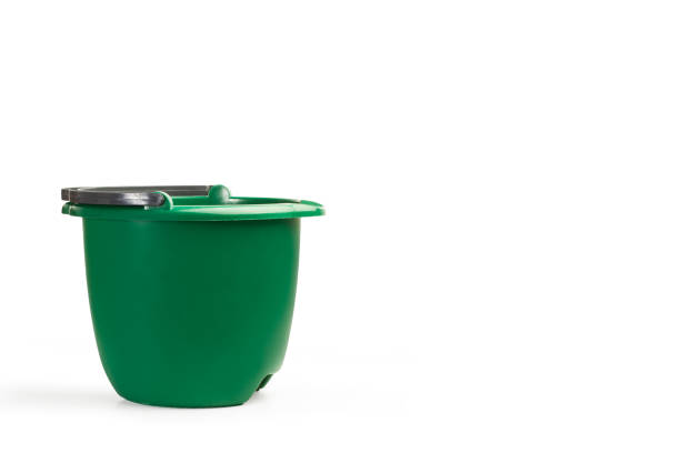 istock A green cleaning bucket on a white background 1372564963