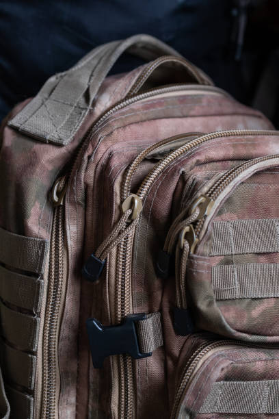 istock Camouflage backpack. Military equipment is special 1372566294