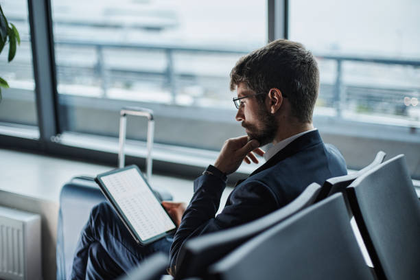 istock businessman with a digital tablet reading business documents 1372568029
