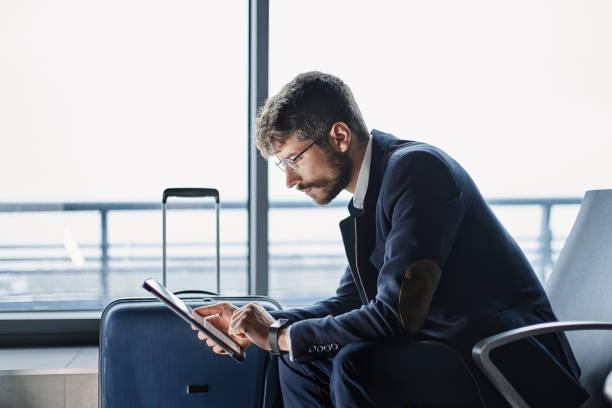 istock businessman with a digital tablet reading business documents 1372568044