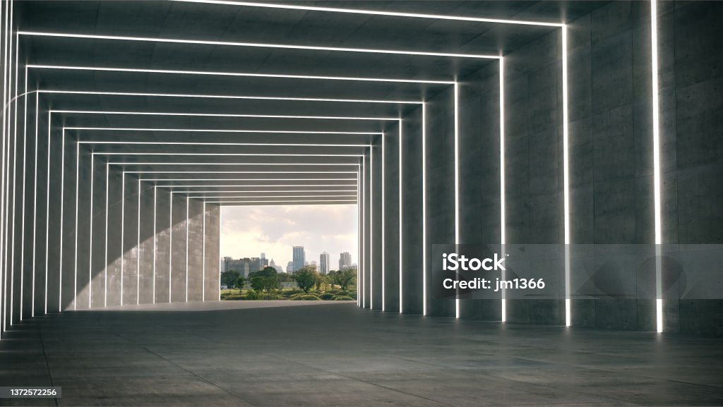 A long corridor with the light glow with the park in the evening background. A long corridor with the light glow with the park in the evening background.3d rendering. LED Light Stock Photo