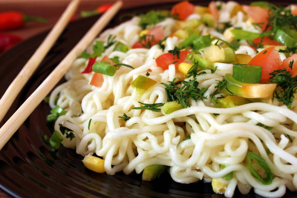 Seasoned noodles on a plate with chopsticks
