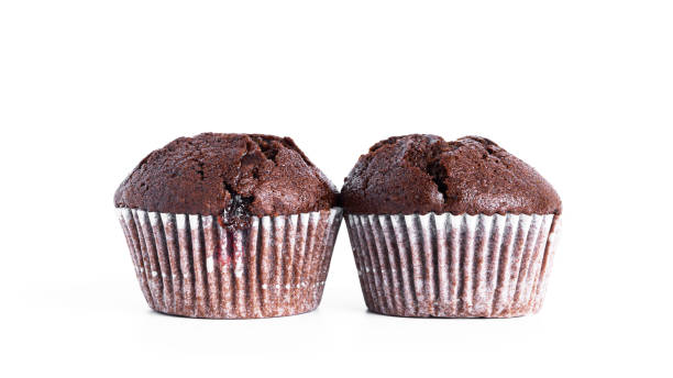 istock Chocolate cupcakes with cherry jam isolated on a white background. Chocolate muffin 1372575847