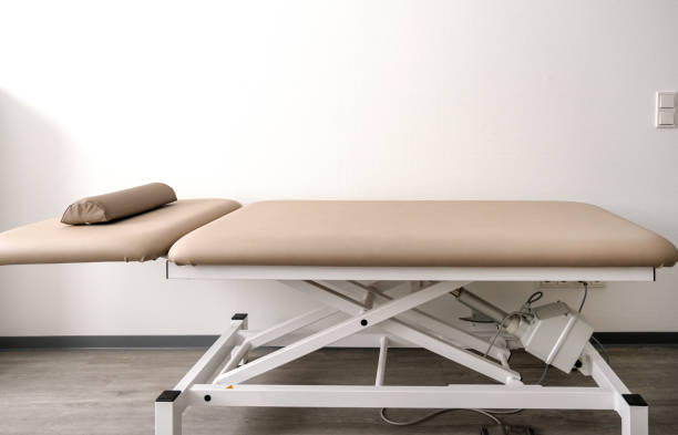 Empty adjustable examination couch or treatment couch in a doctor's office, clinic or physiotherapy practice