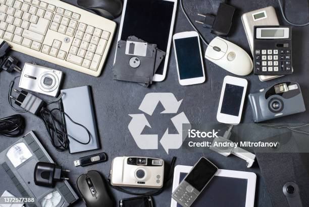 Old Electronic Devices On A Dark Background The Concept Of Recycling And Disposal Of Electronic Waste Stock Photo - Download Image Now