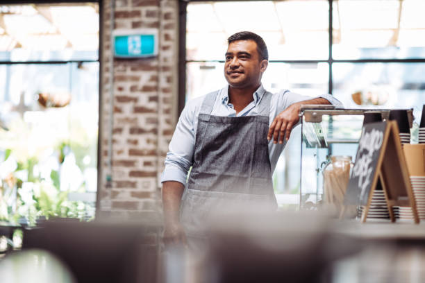 istock Pacific Islander bartender running the cozy cafe bar after reopening 1372577567