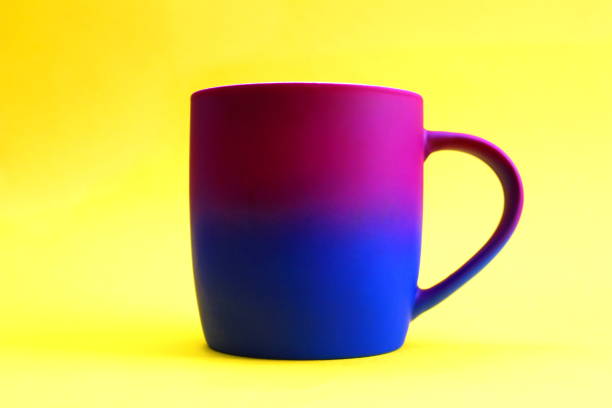 istock A bright multi-colored mug stands on an isolated background. 1372579291