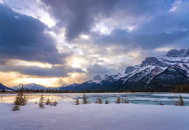 istock Sunrise Clouds Over Snowy Mountains And Lake 1372581392