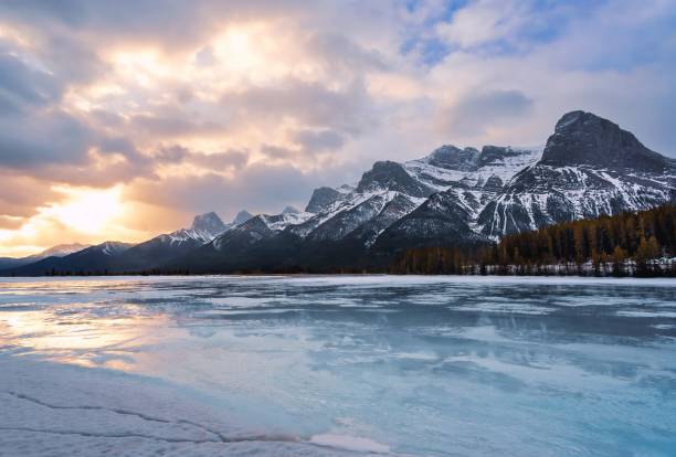 istock Sunrise Clouds Over A Frozen Mountain Lake 1372581481