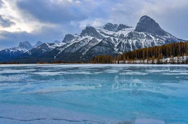 istock Clouds Over A Frozen Mountain Lake 1372581545