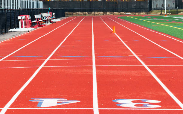 Red track looking from Finish line to 100 meter start line stock photo