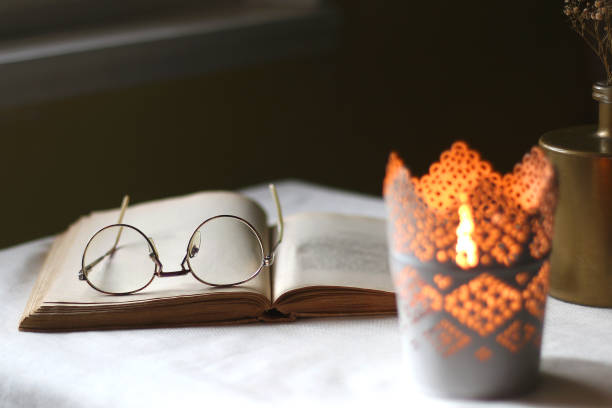 istock Book, Glasses, Candle and Vase 1372583919