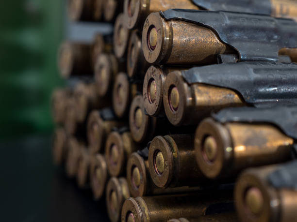 istock Cartridges from a machine gun on a black background 1372584013