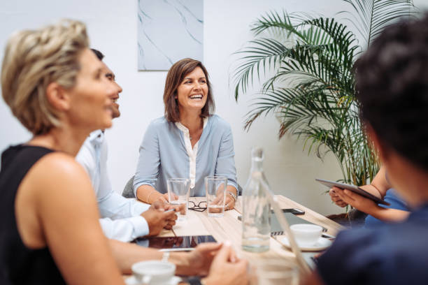 istock Teamwork in office - employees working together in office 1372584208