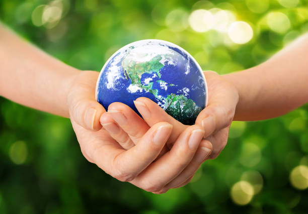 istock Care and Protect our World in human hands concept 1372584236