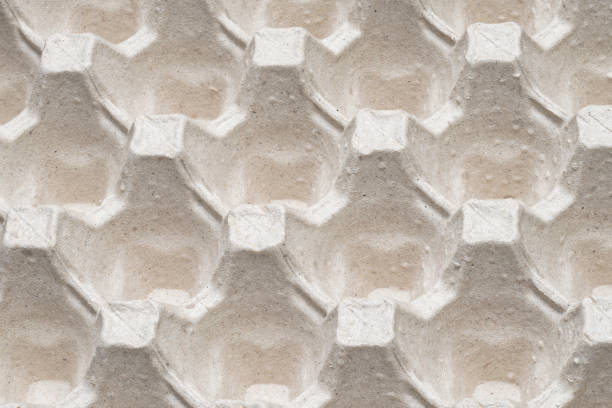 istock Closeup of egg carton texture. Patterned background 1372584770