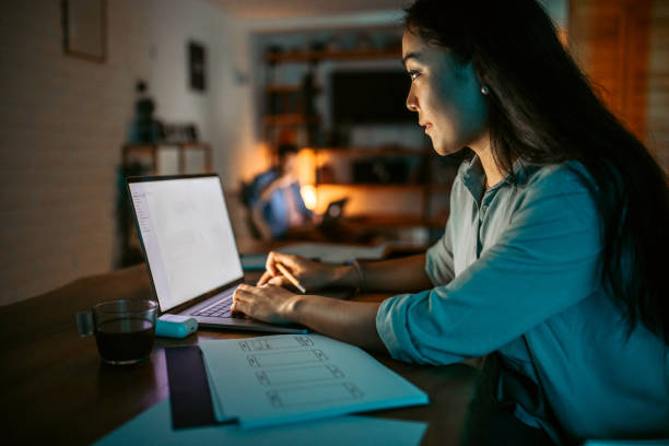 istock Young asian woman finishing work project before deadline 1372587531