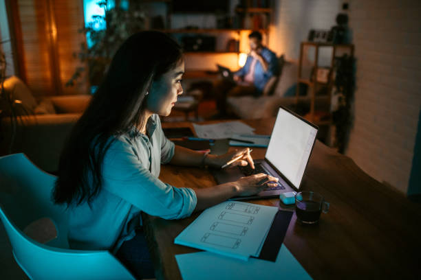 istock Young asian woman finishing work project before deadline 1372587544