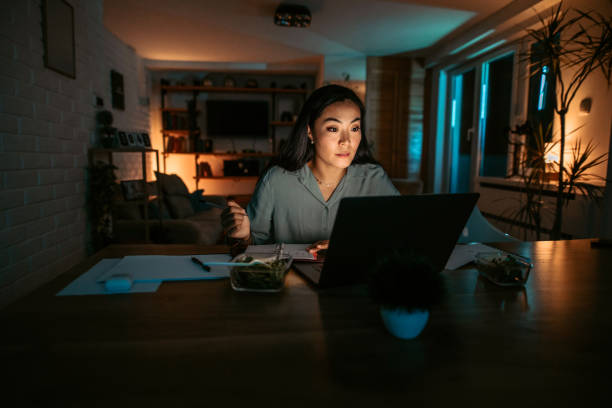 istock Young asian woman finishing work project before deadline 1372588542