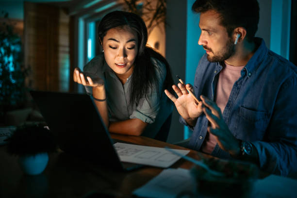 istock People in the office working late at night together 1372588902