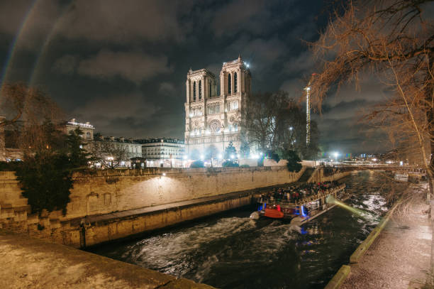 Notre Dame Cathedral and Seine river at night