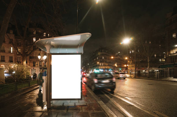 istock Bus stop with blank poster at night 1372592037