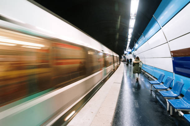 Subway train in motion in a station stock photo