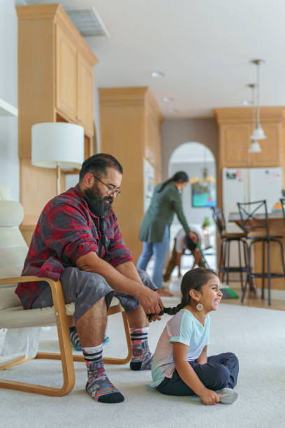 istock Native American dad braiding his daughter's hair 1372594210