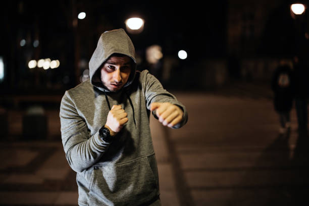 Night training of a young boxer in the city