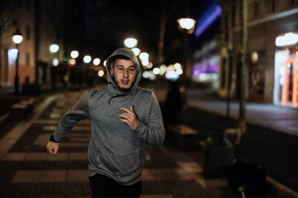 istock Fitness handsome man training. Jogging at the evening.. 1372595171