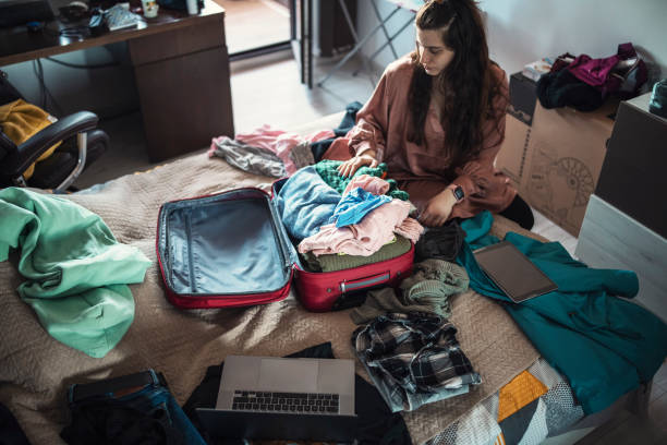 istock Packing luggage for a vacation. 1372596493