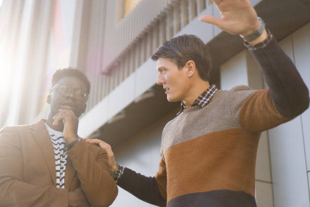 istock Two Casual businessmen talking outside 1372599292