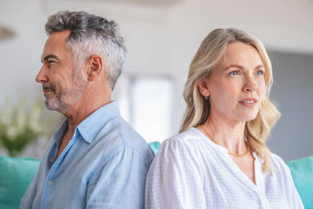 istock Mature couple fighting at home sitting on the sofa. 1372599323