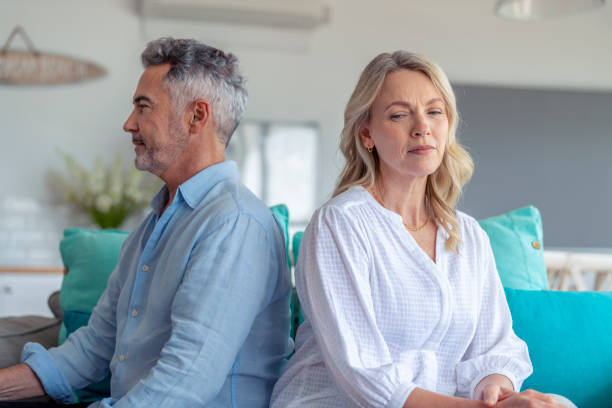 istock Mature couple fighting at home sitting on the sofa. 1372599336