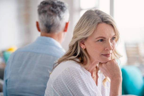 istock Mature couple fighting at home sitting on the sofa. 1372599342